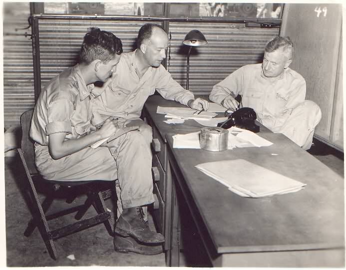 Norman Ramsey, Deak Parsons, and Thomas Farrell meeting on Tinian